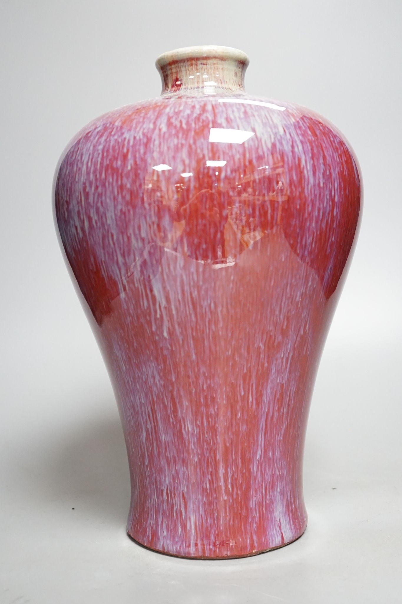 A sang-de-boeuf baluster vase, 30cm